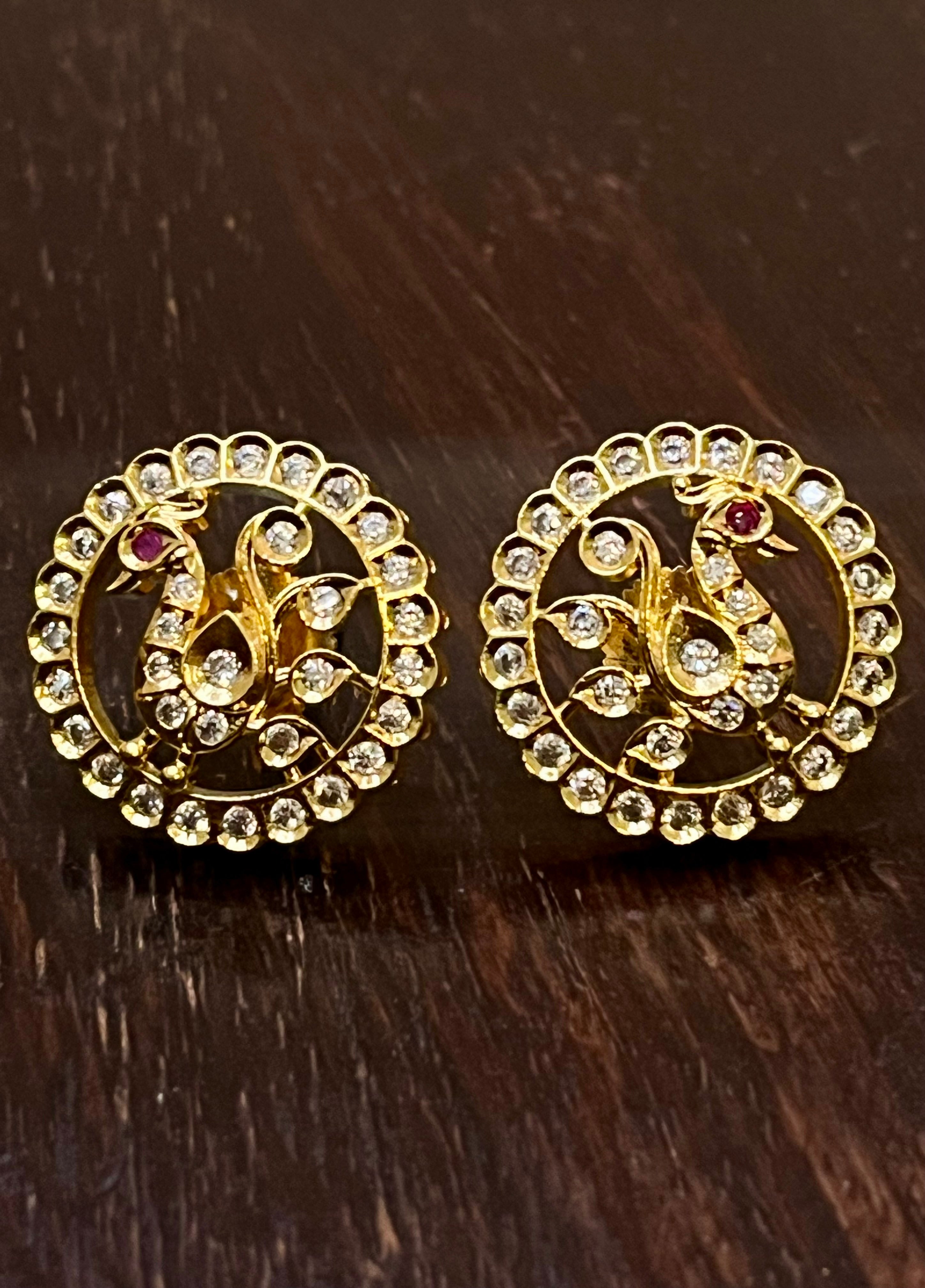 Peacock studs with white stones