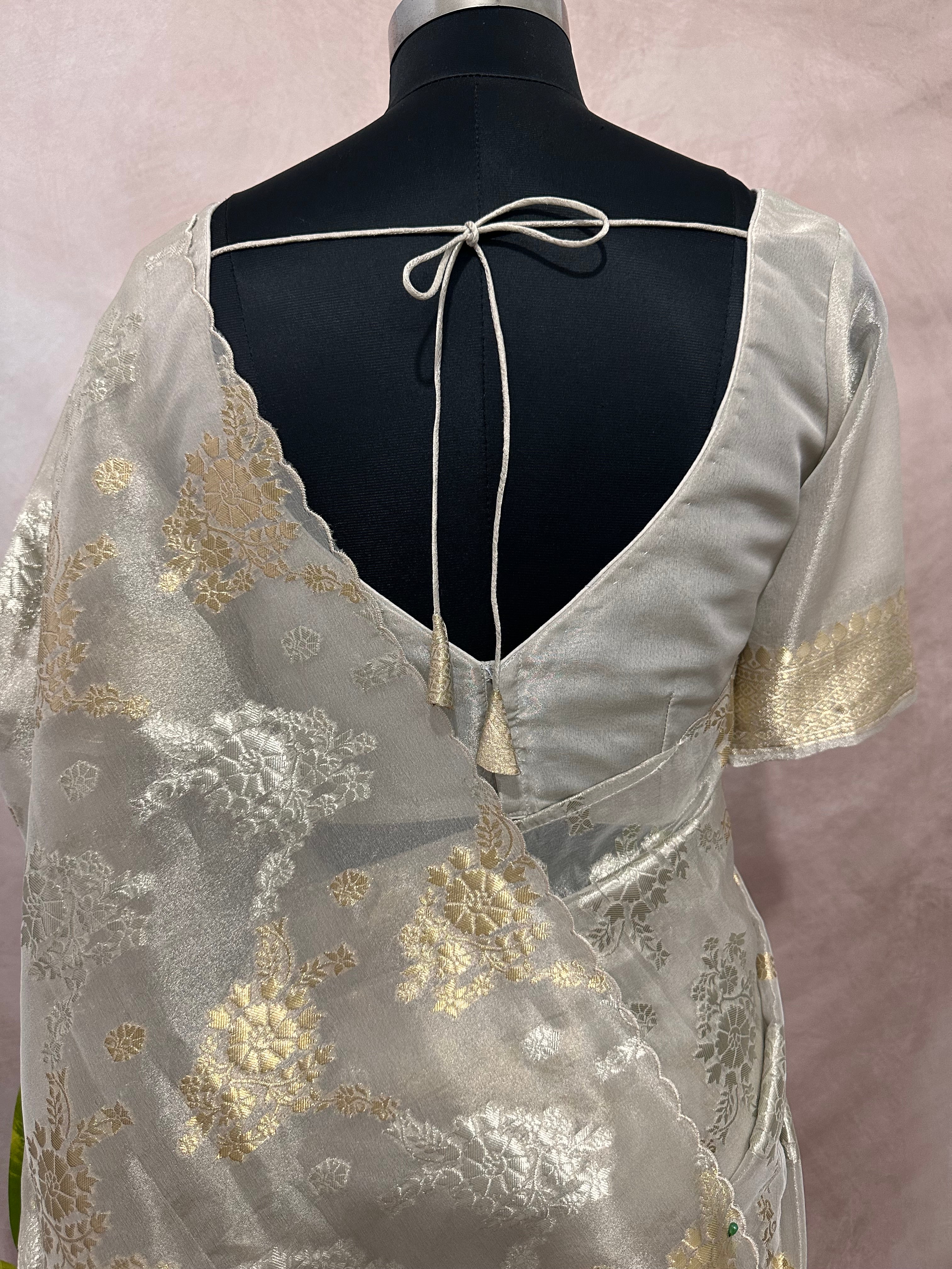 Silver tissue saree with gold floral weave, with stitched blouse