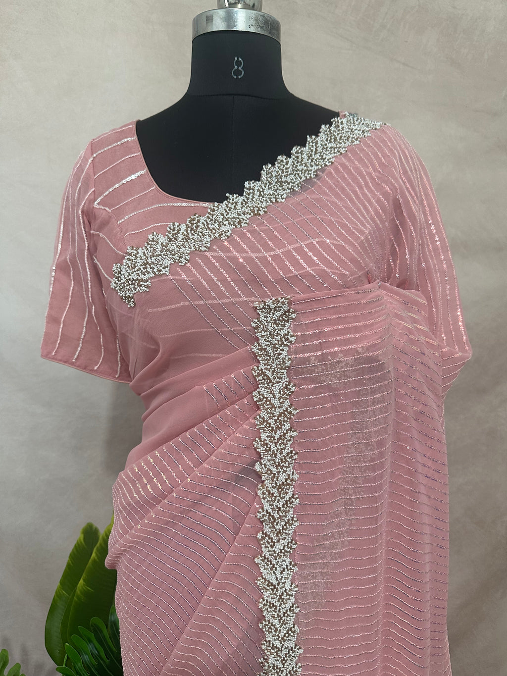 Light pink georgette saree with bead embroidery and stitched blouse