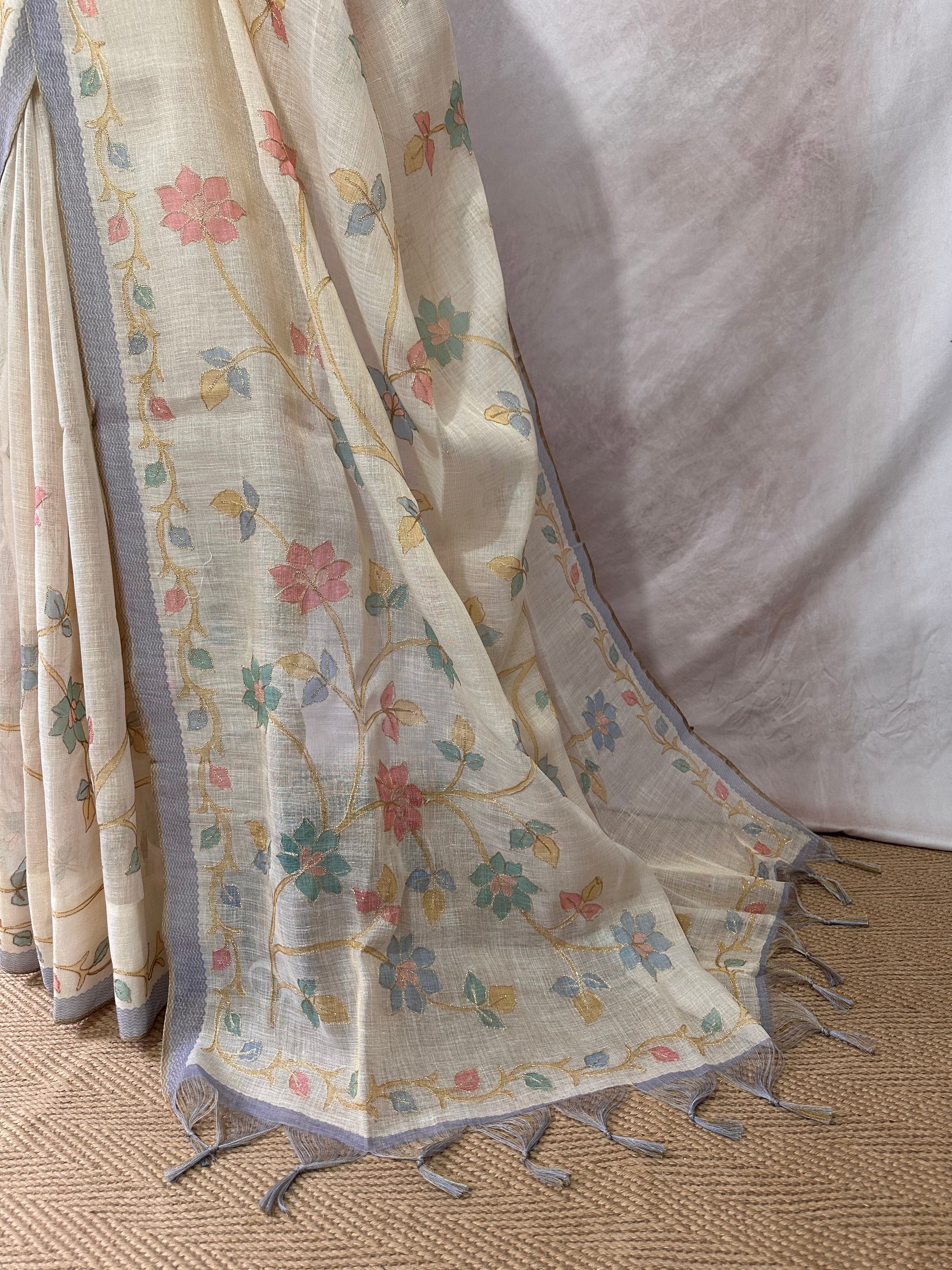 Printed Tissue linen saree with thread work, and stitched blouse