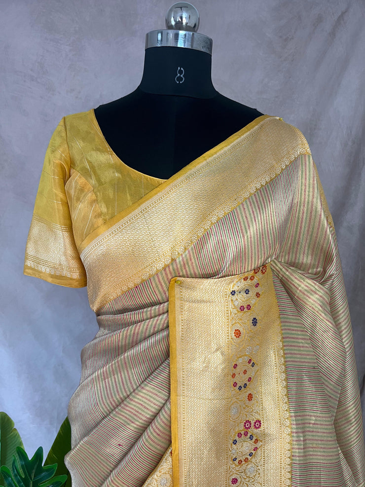 Yellow tissue organza saree with katan border with meenakari weave, stitched blouse