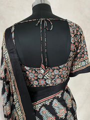 Black modal silk saree with hand work and stitched blouse