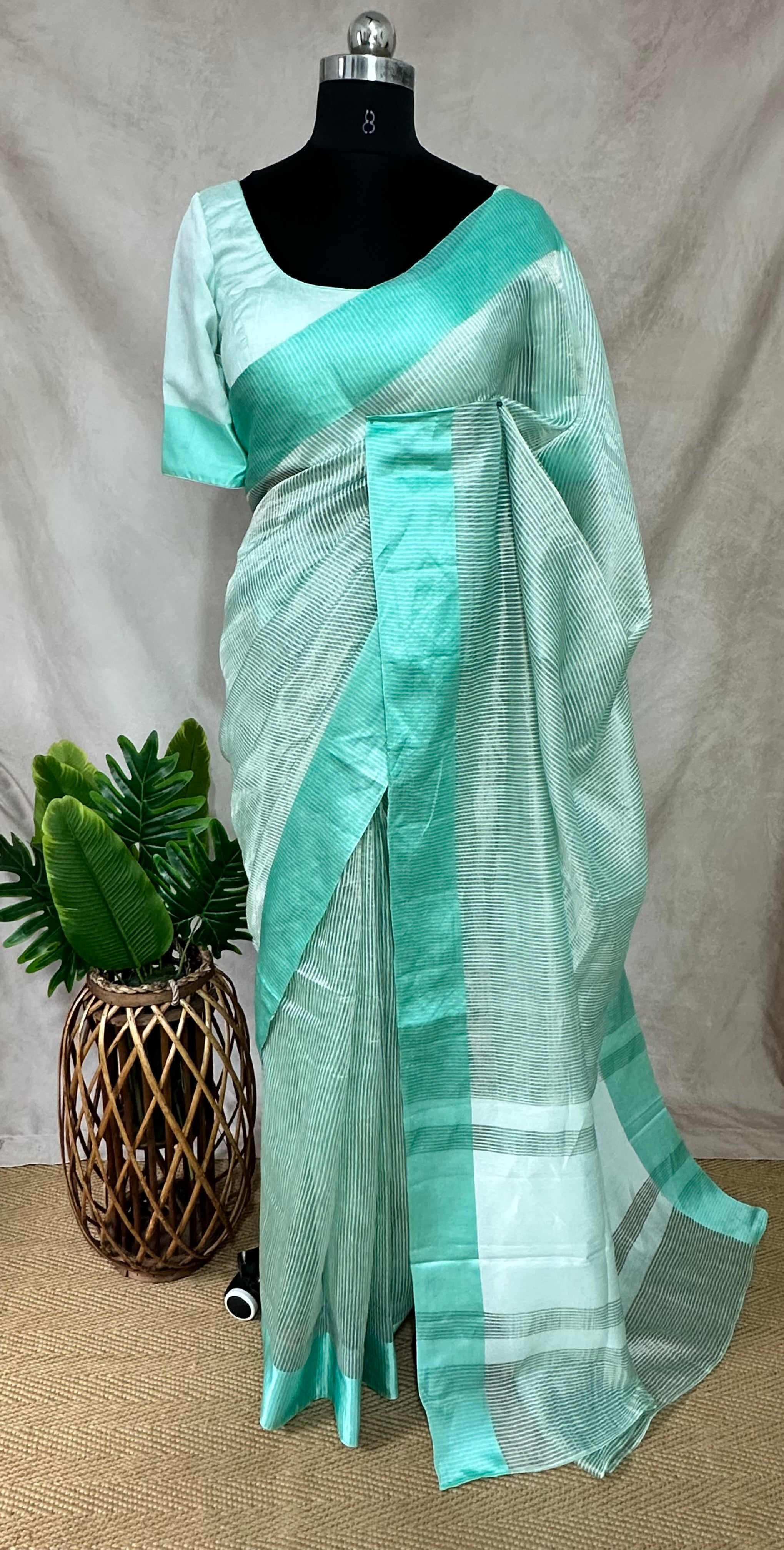Light pista green stripe tissue silk saree with stitched blouse