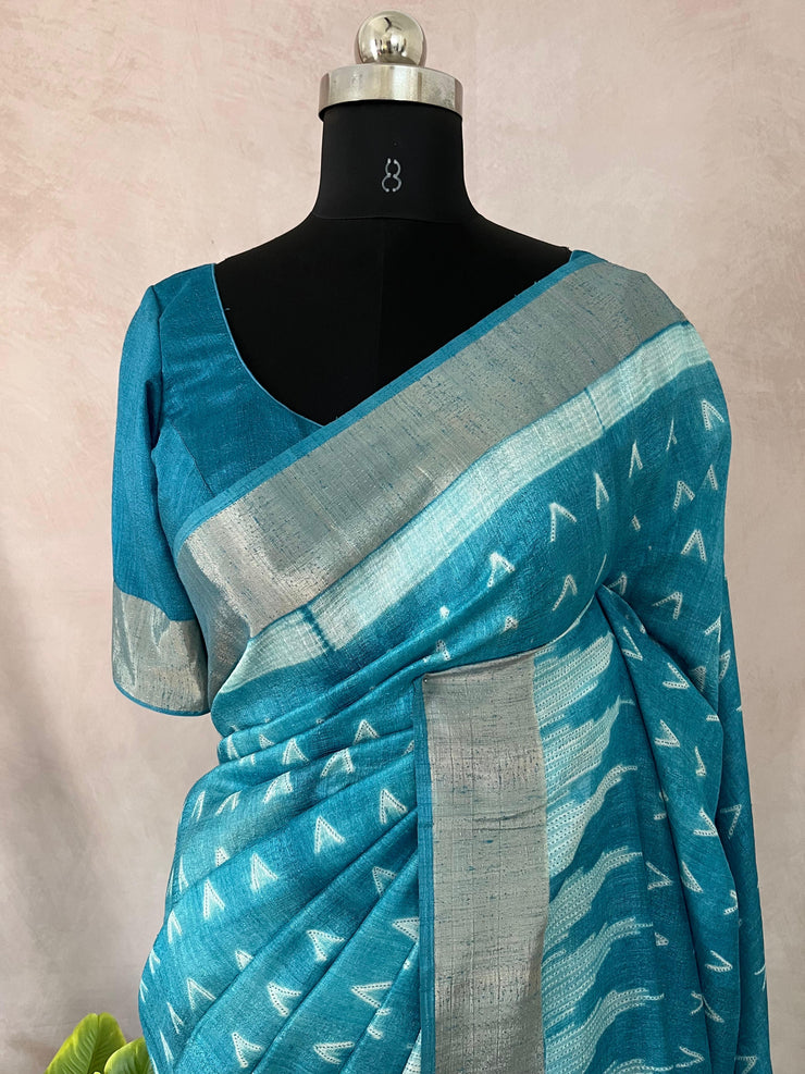 Light blue semi soft tussar silk saree with floral print, with stitched blouse