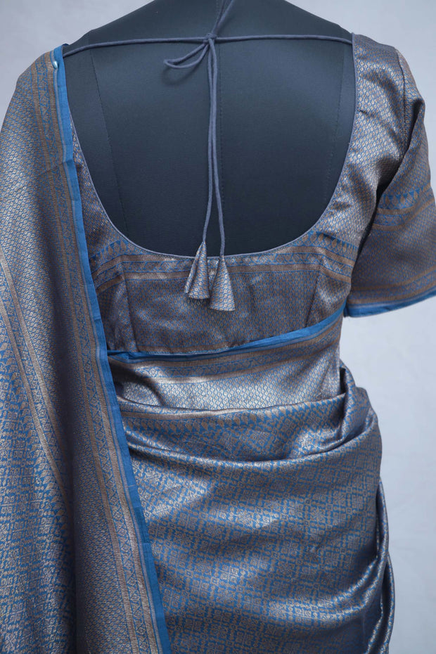 Blue brocade organza saree with stitched blouse