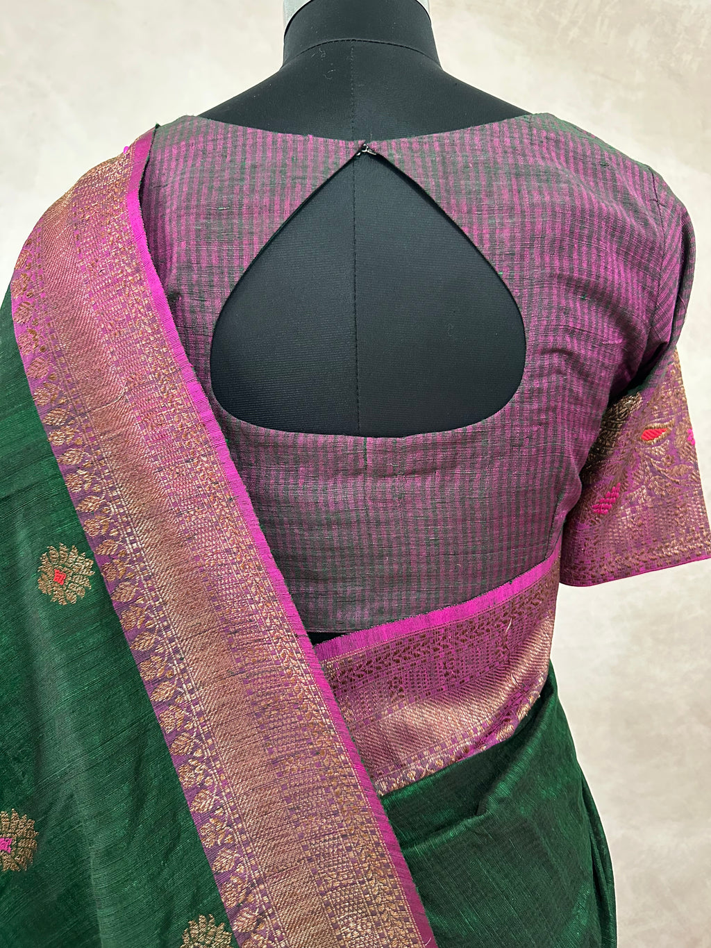 Bottle green dupion silk saree with meenakari weave and stitched blouse