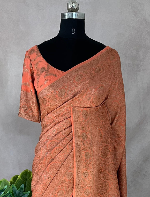 Pure Crepe silk saree with antique zari weave, stitched blouse
