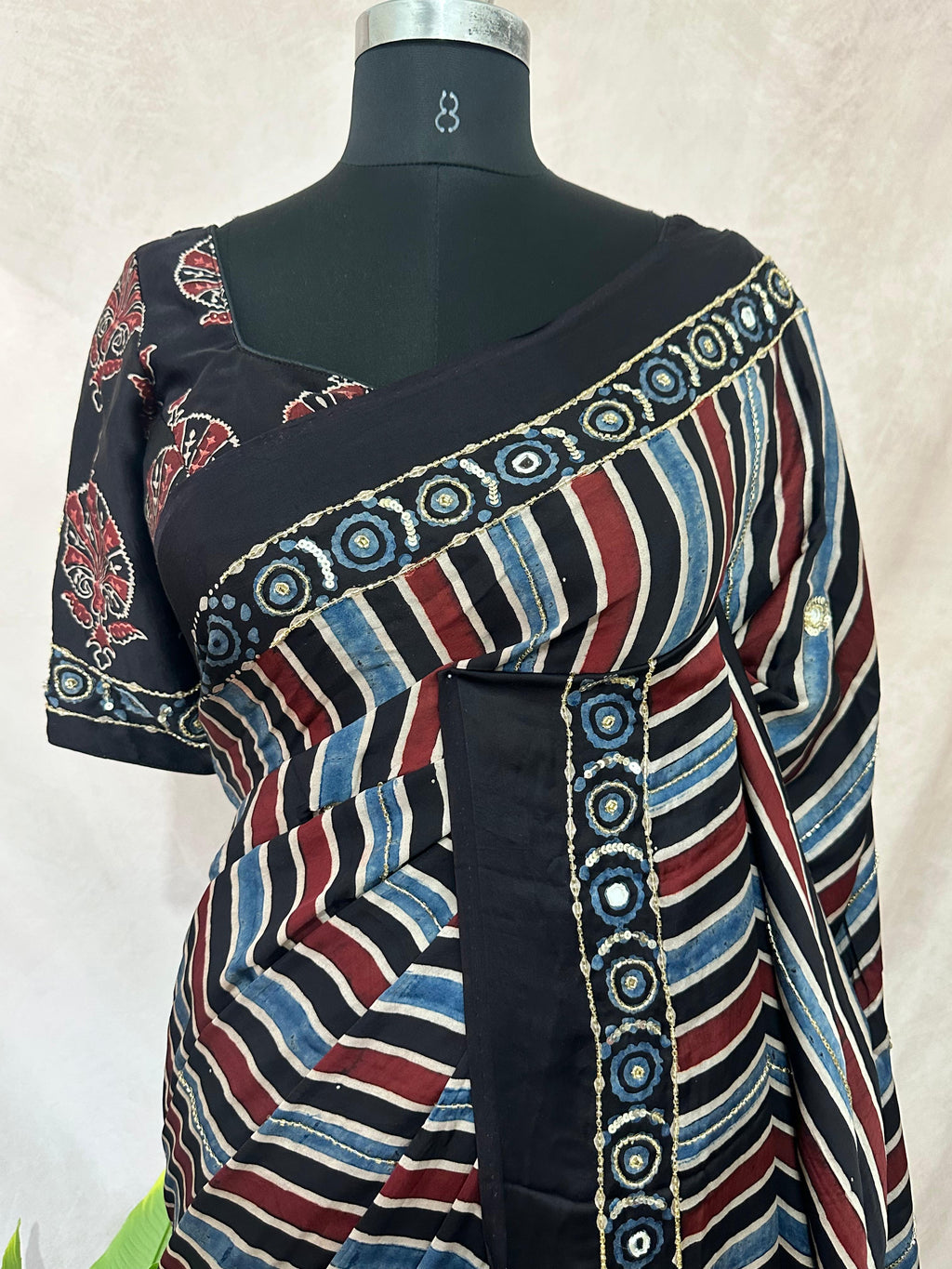 Designer Ajrakh modal silk saree with bead and mirroer handwork, stitched blouse