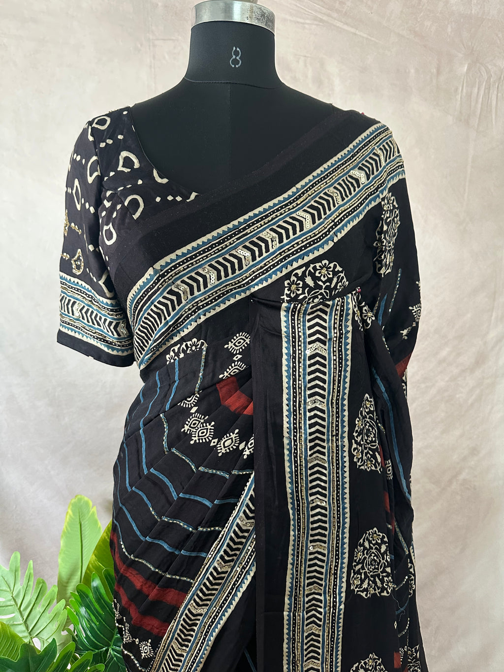 Modal silk saree with bead and mirror work , stitched blouse