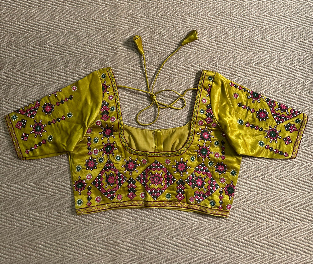 Yellow modal silk blouse with mirror work and hand Kutch Embroidery