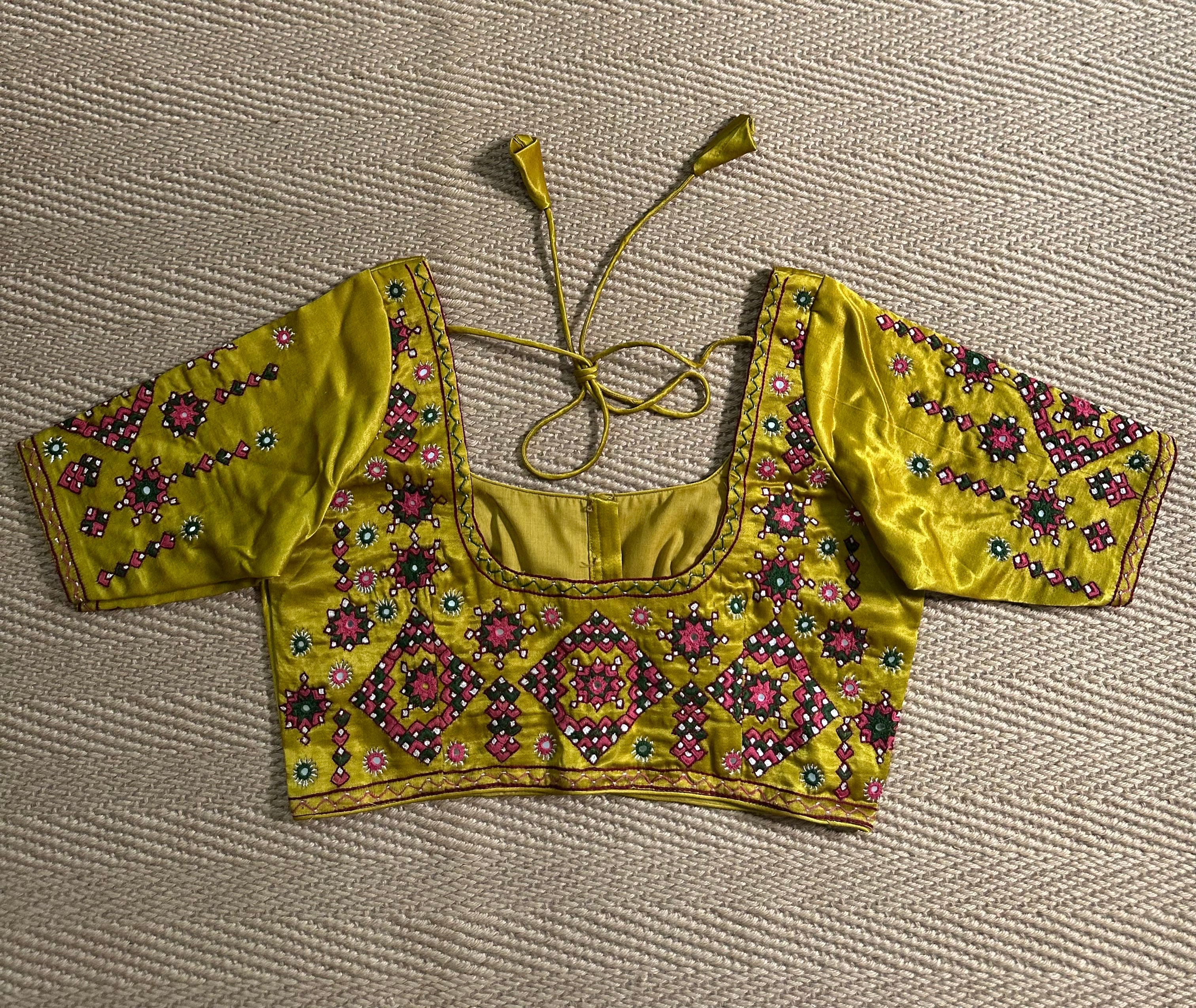 Yellow modal silk blouse with mirror work and hand Kutch Embroidery
