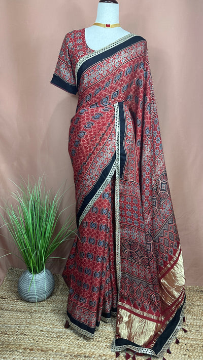 Hand block Ajrakh print Red modal silk saree with gotta patti border, with stitched blouse