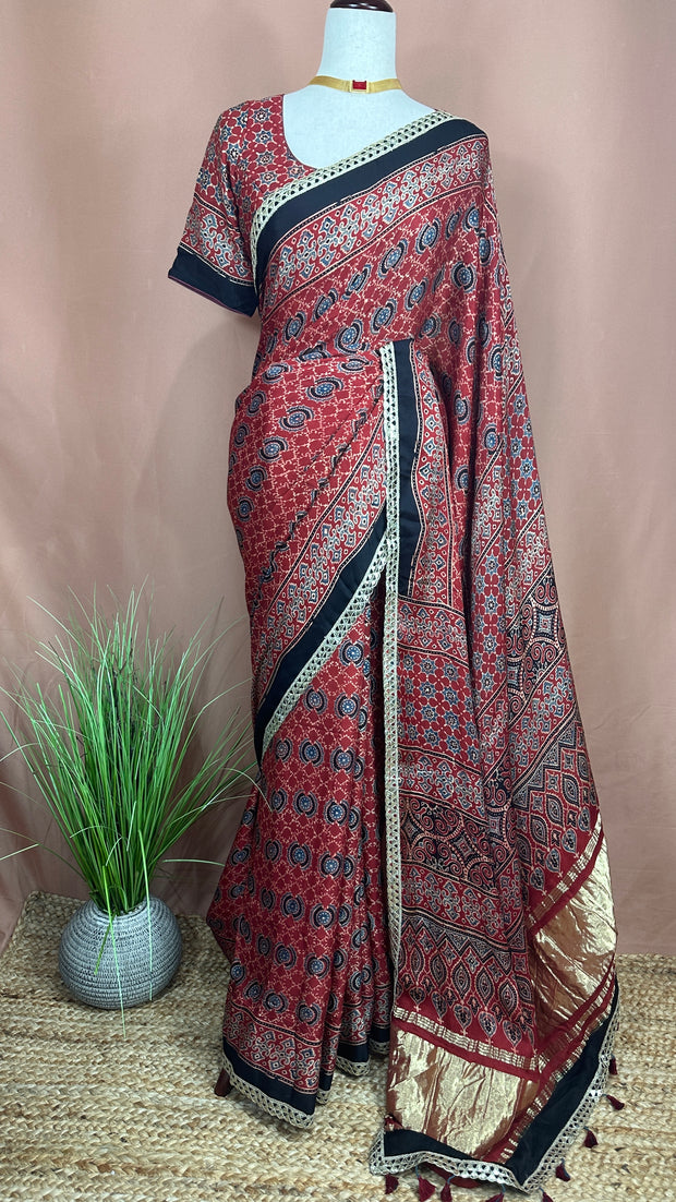 Hand block Ajrakh print Red modal silk saree with gotta patti border, with stitched blouse