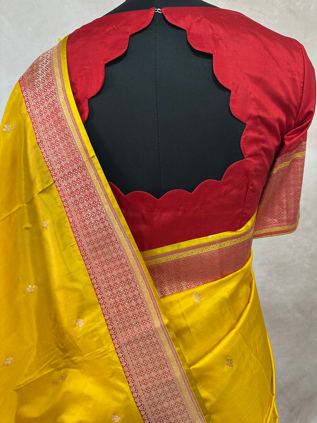 Yellow and red pure katan silk saree with stitched blouse