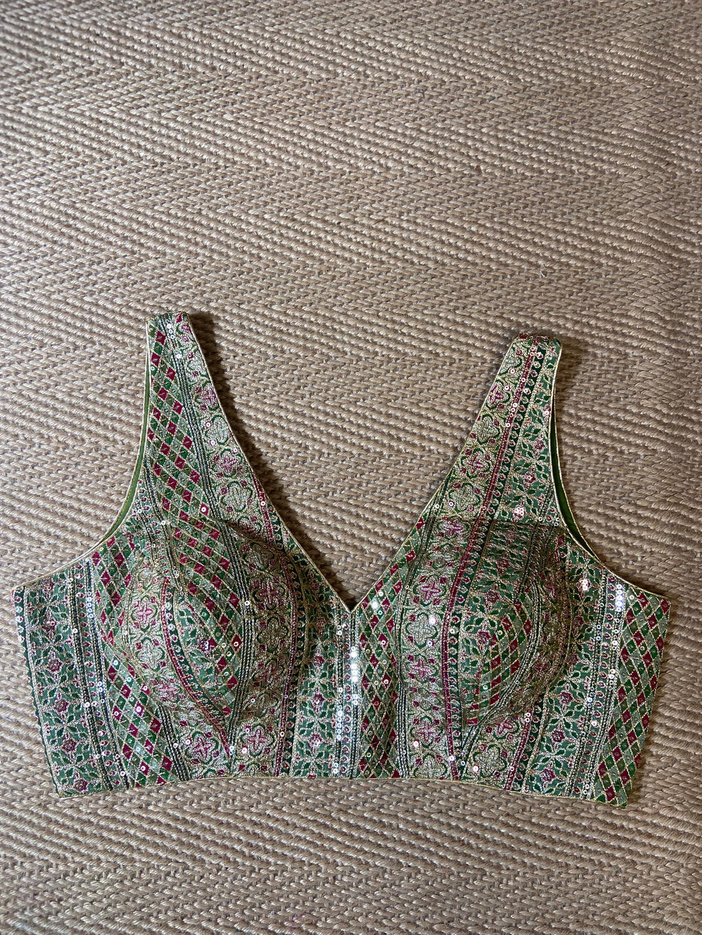Green sleeveless blouse