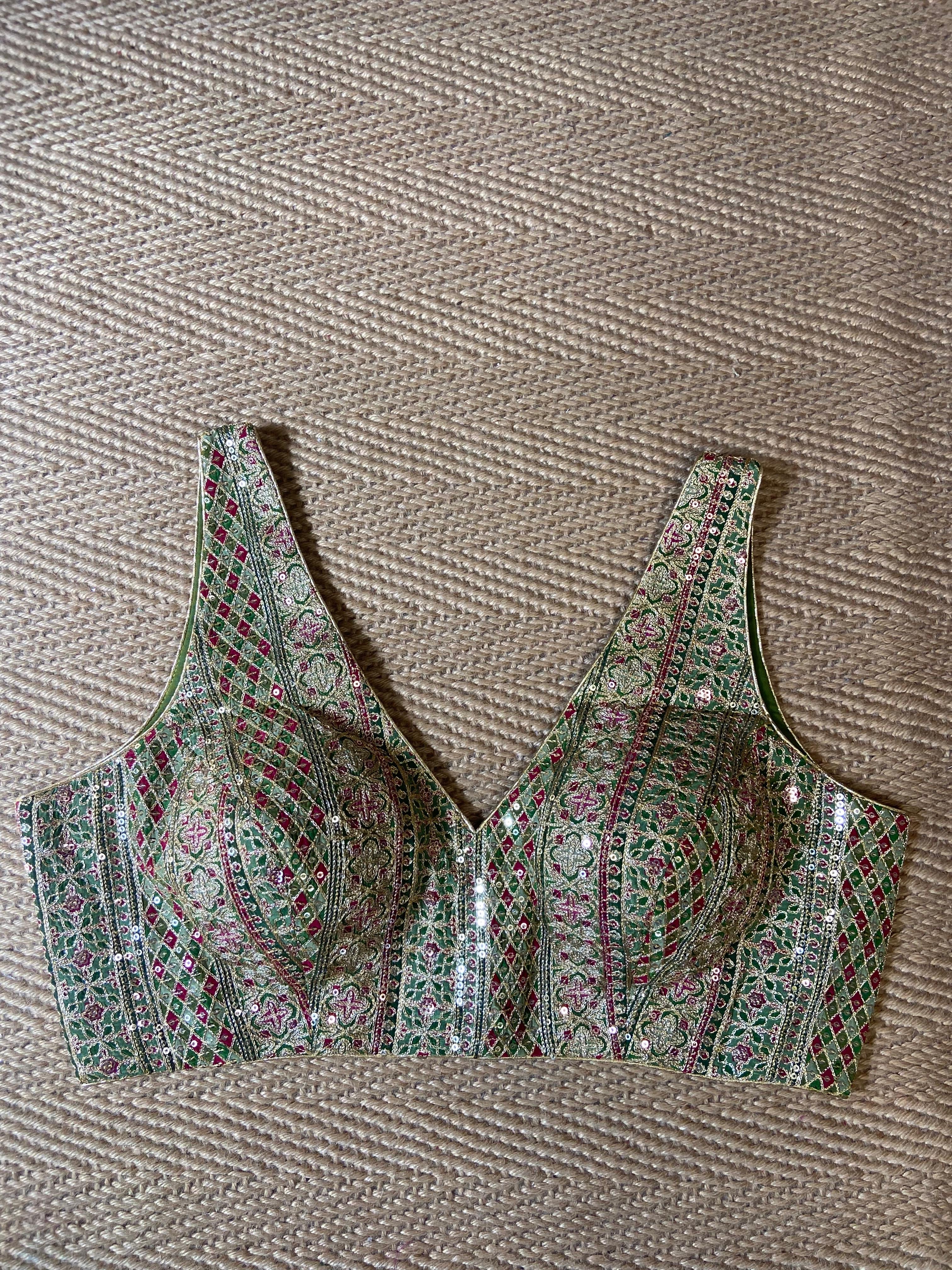 Green sleeveless blouse