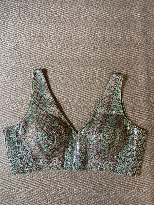 Green sleeveless blouse