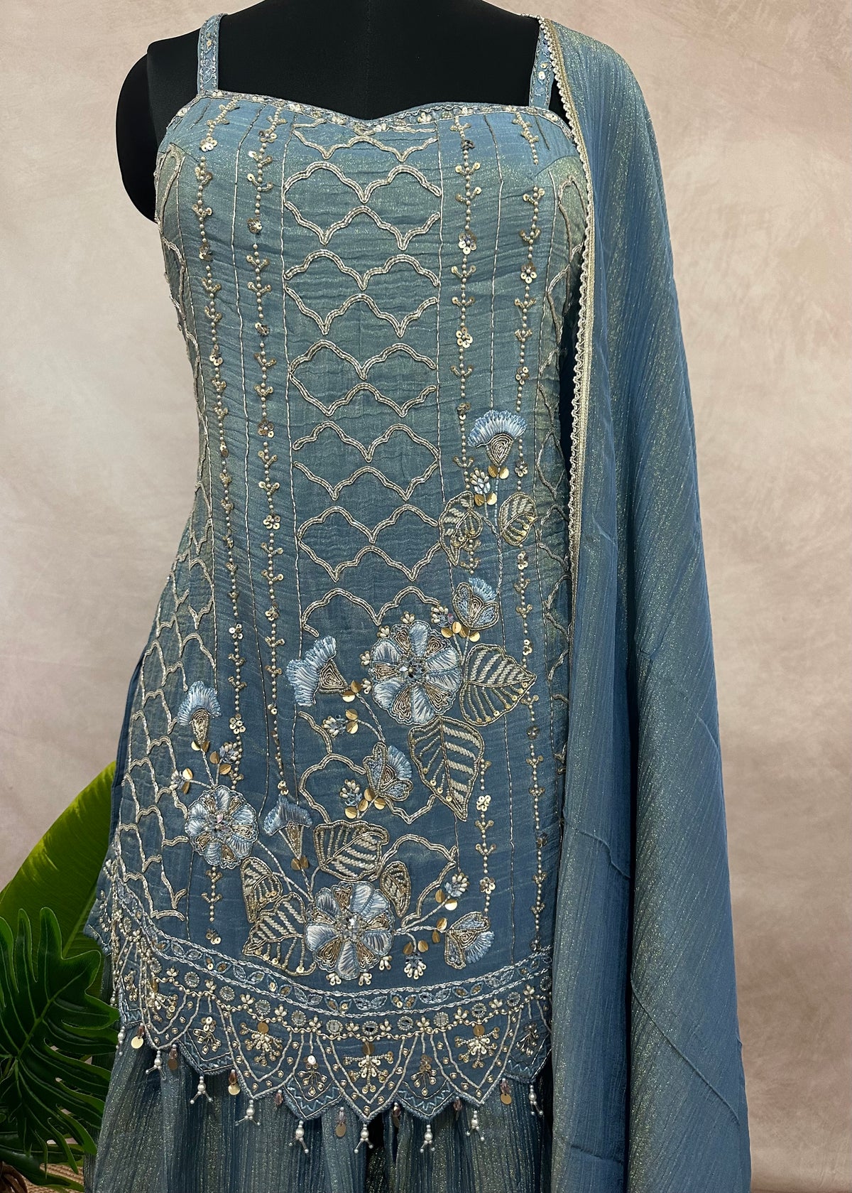 Light blue deisgner short top with flared bottom