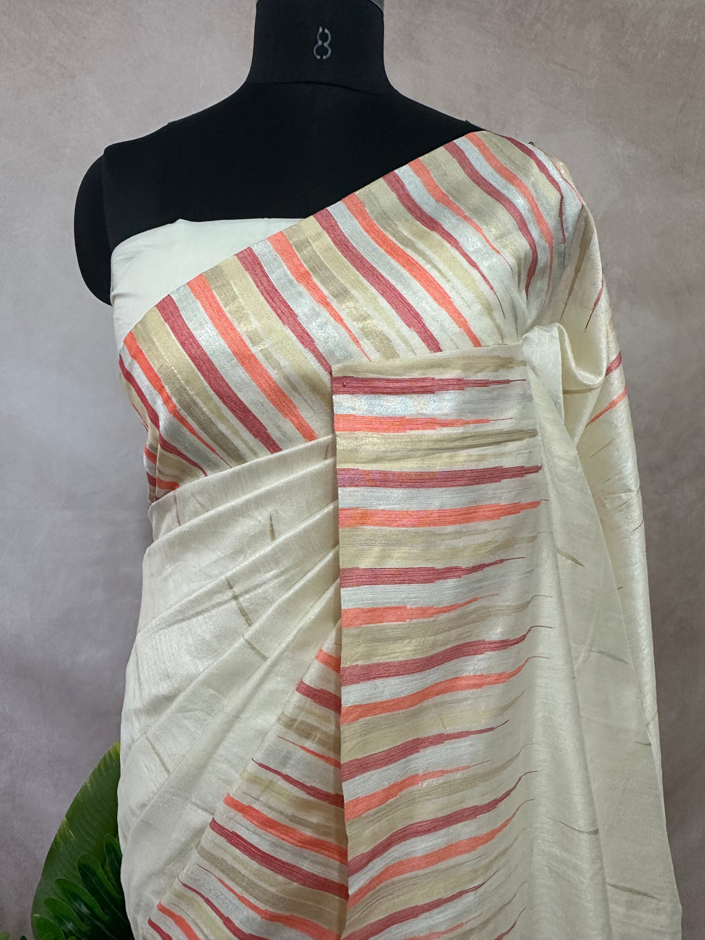 Off white Semi silk saree with peach and gold temple border