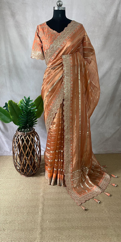 Orange Tissue oraganza saree with designer blouse