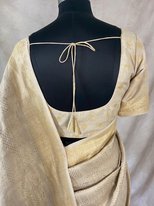 Beige tussar brocade saree with meenakari weave, stitched blluse