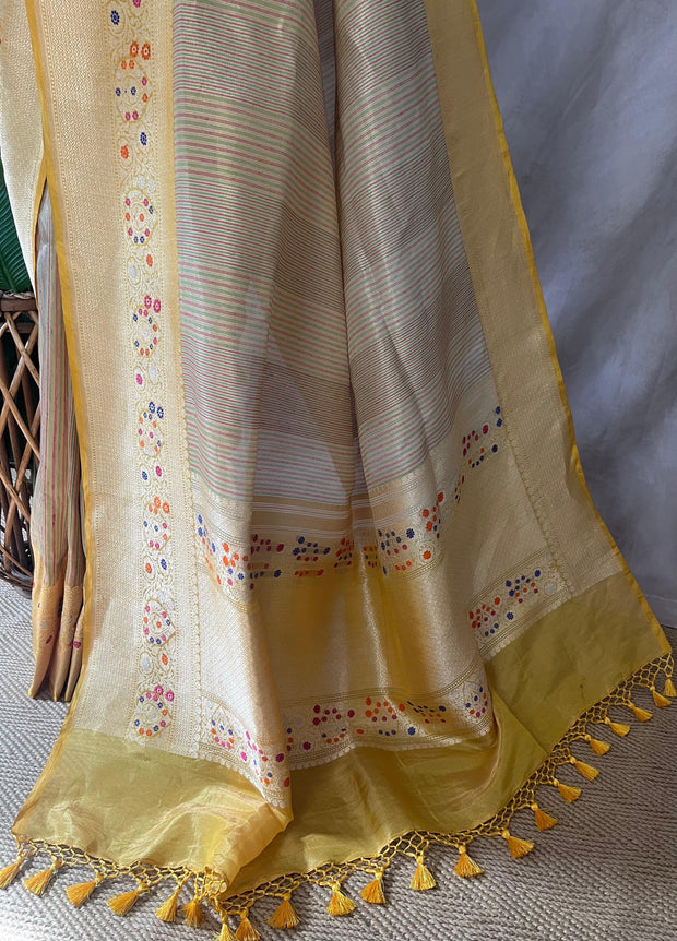 Yellow tissue organza saree with katan border with meenakari weave, stitched blouse