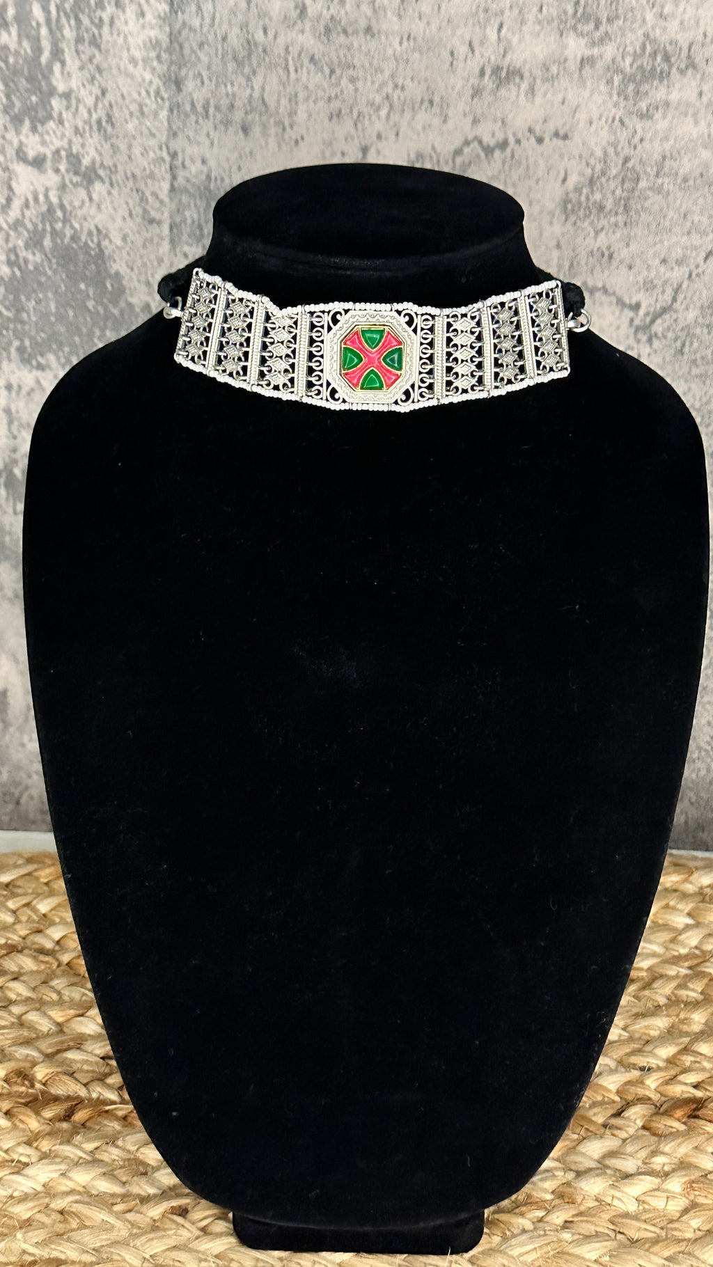 Choker with green and pink stones and studs