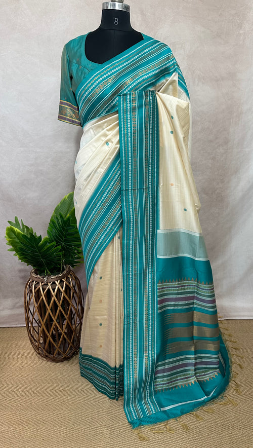 Asam silk saree with Turquoise green broder and stitched blouse