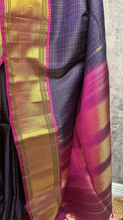Navy blue Kanchivaram saree with purple border, with stitched blouse
