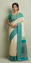 Asam silk saree with Turquoise green broder and stitched blouse