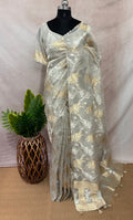 Silver tissue saree with gold floral weave, with stitched blouse