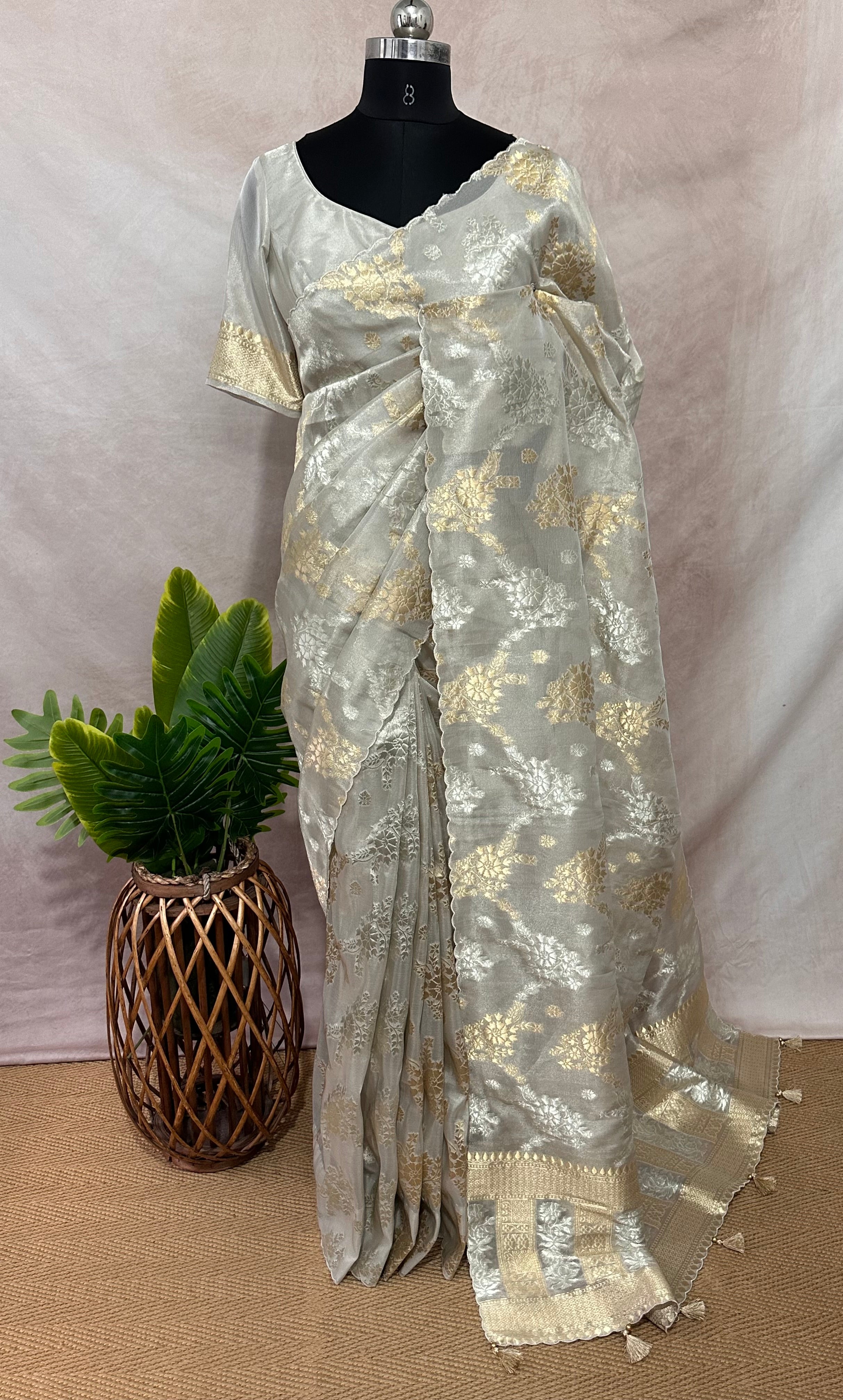 Silver tissue saree with gold floral weave, with stitched blouse