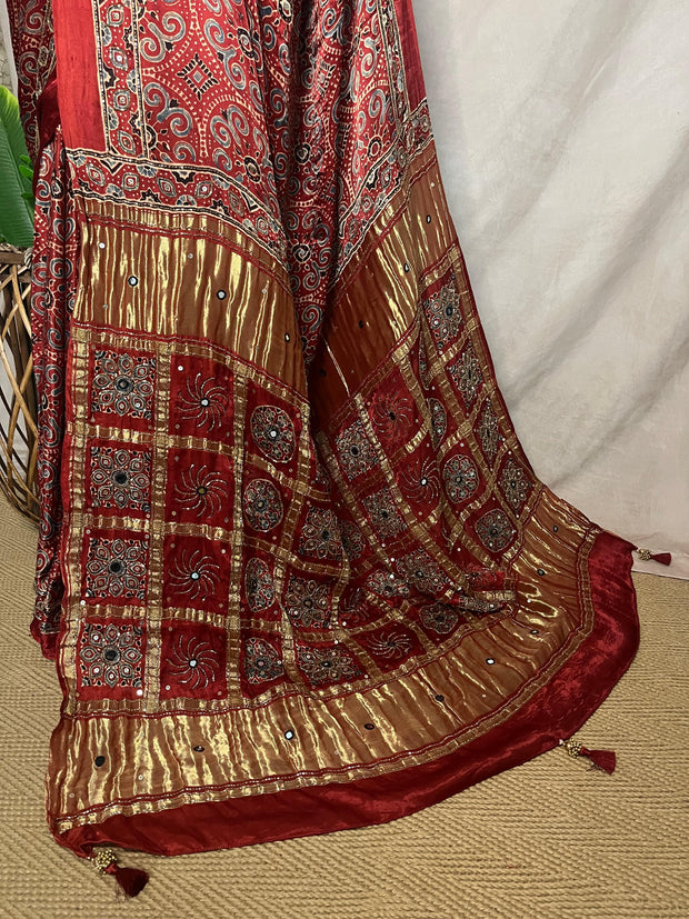Red Ajrakh printed maroon modal silk saree with hadnwork and gharchola pallu, with stitched blouse