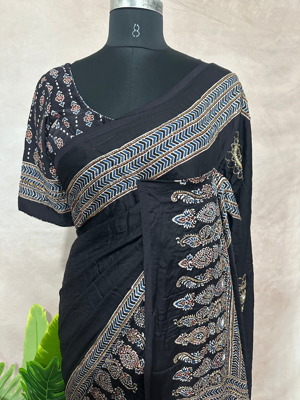 Modal silk saree with bead and mirror work , stitched blouse