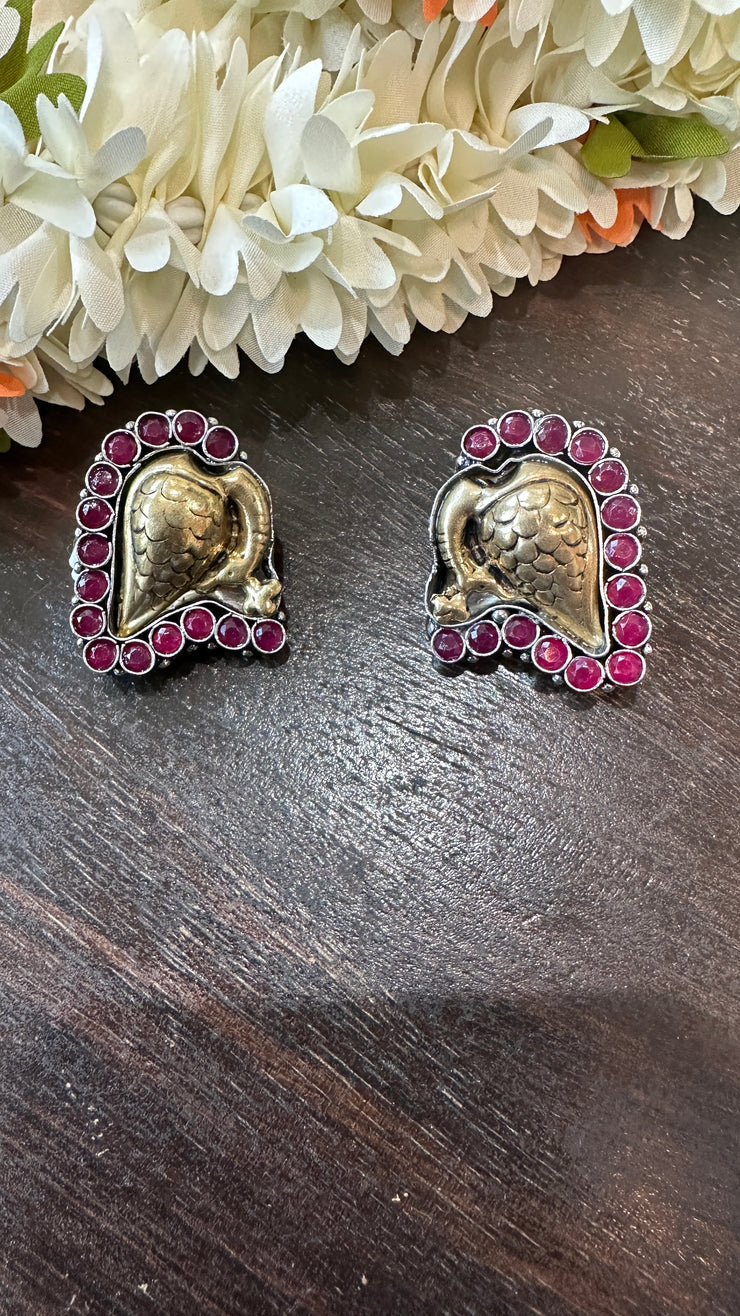 Dual tone studs with red stone