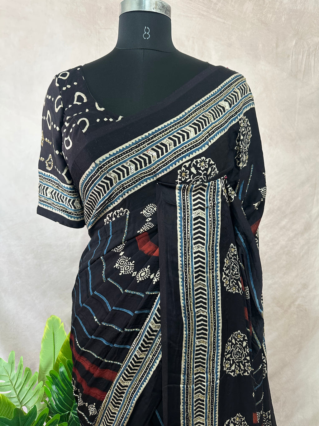 Modal silk saree with bead and mirror work , stitched blouse