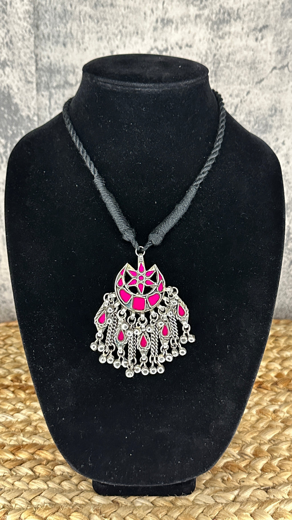 Indian Pink glass pendent with black thread