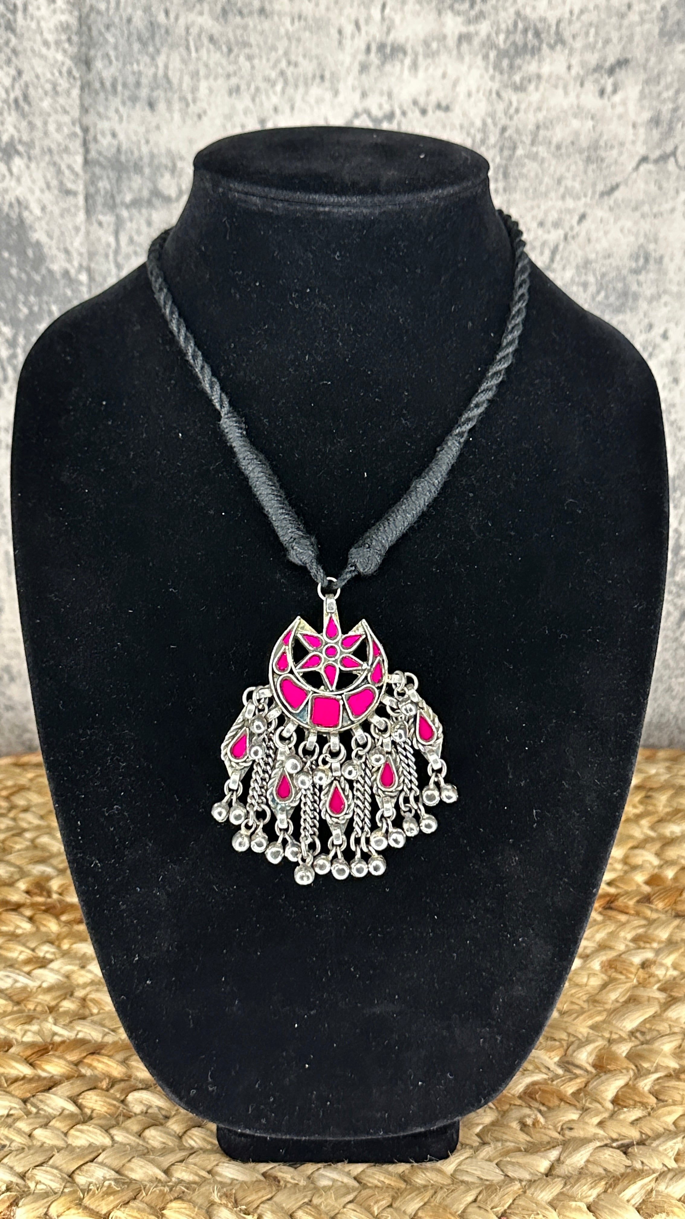 Indian Pink glass pendent with black thread