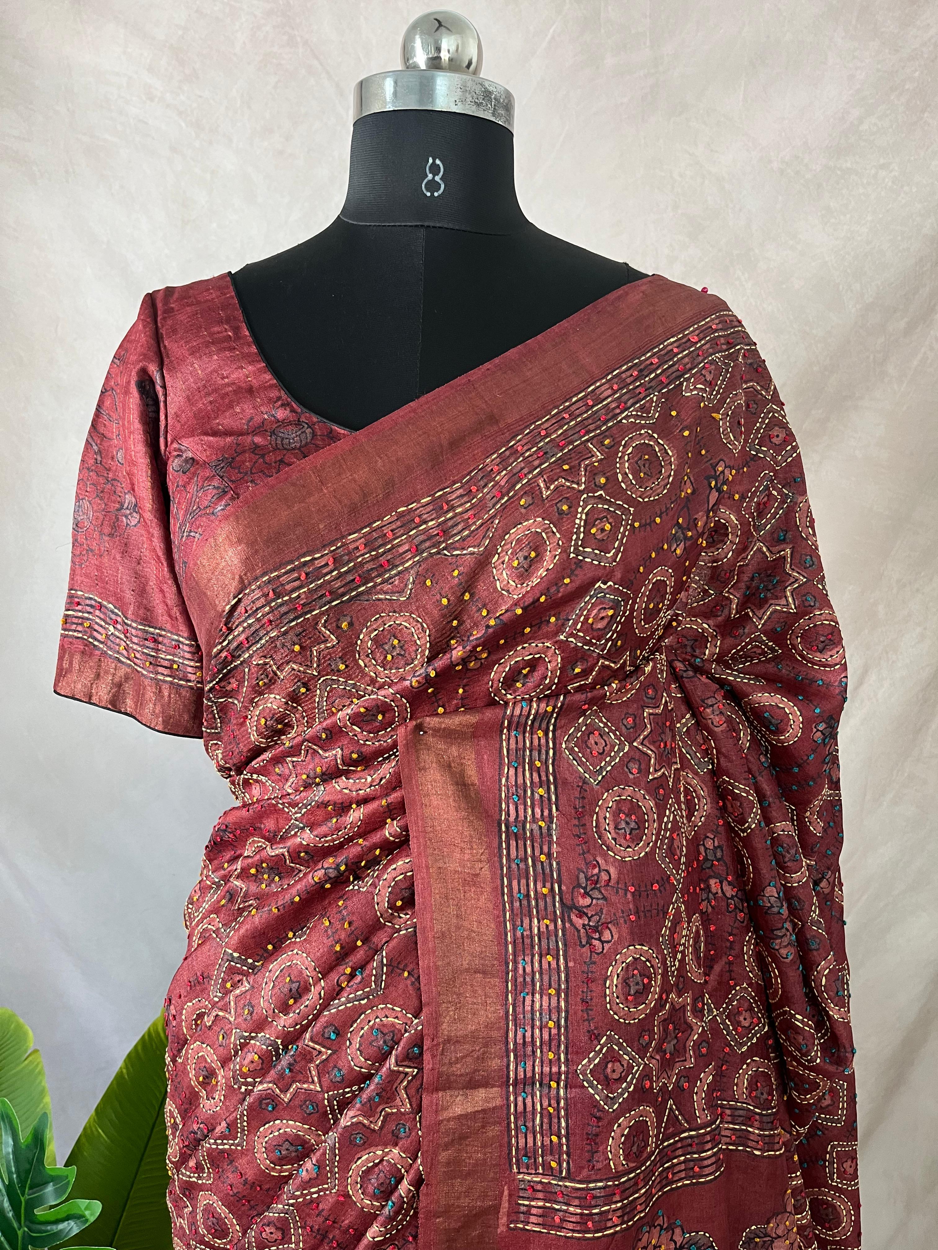 Pure tussar silk saree with Ajrakh hand block printed and high lighted with kanta work and stitched blouse