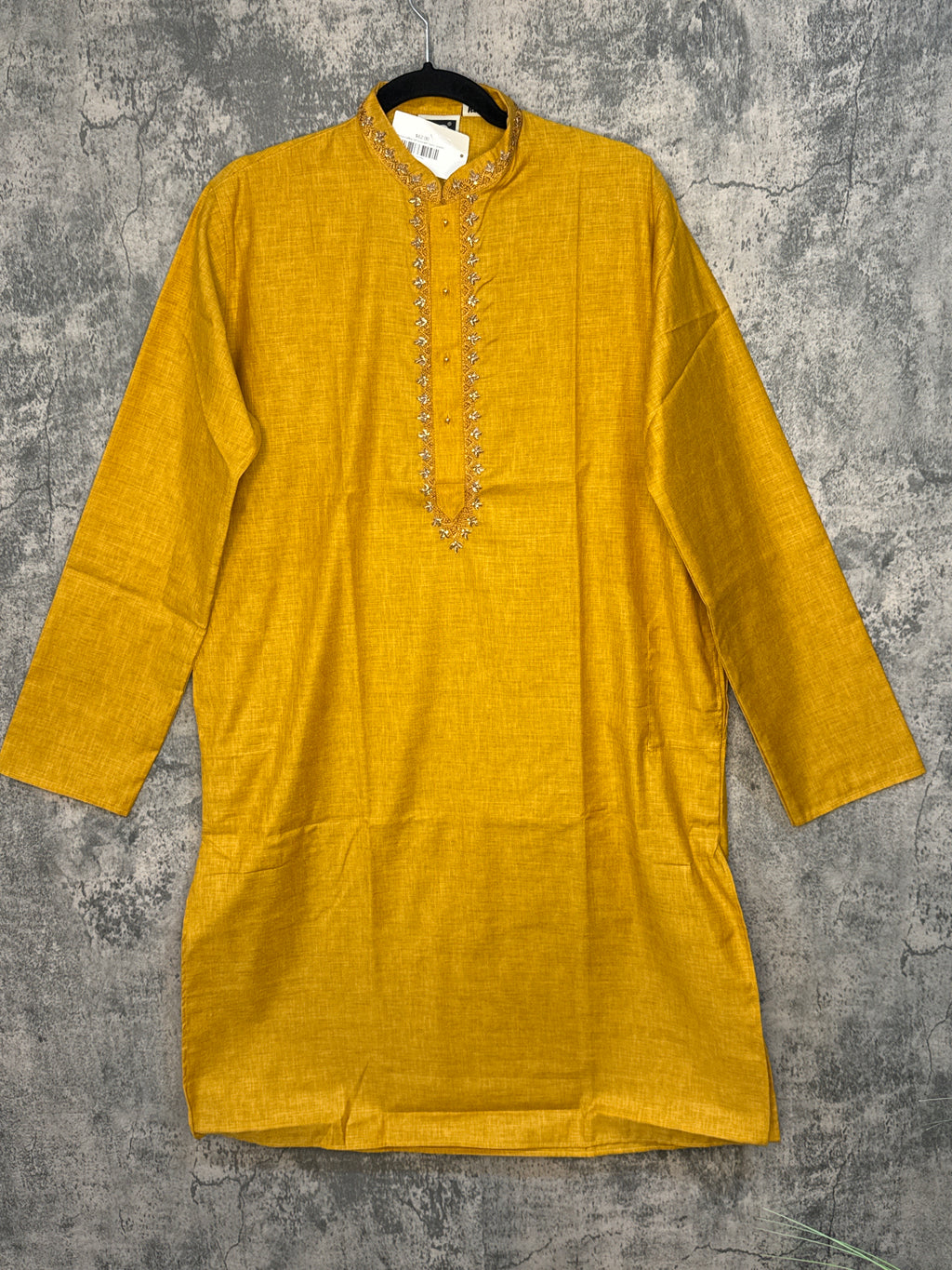 Mustard yellow soft kurta with hand emroidery on the neck