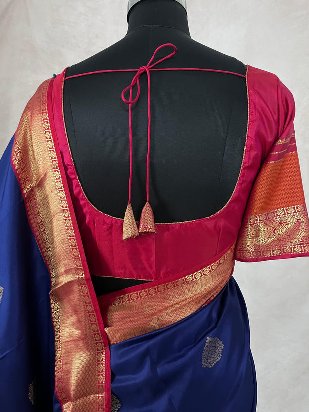 Blue Kanchivaram saree with pink and orange border, and stitched blouse
