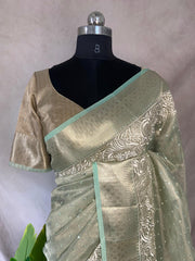 Light green Tissue Kotta silk saree with mirror and chikankari work, with stitched blouse