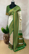 Asam silk saree with green border and stitched blouse