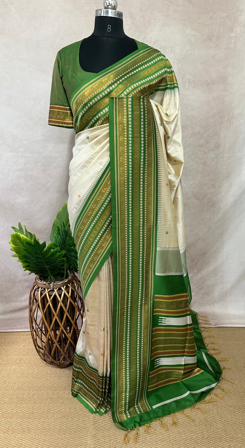 Asam silk saree with green border and stitched blouse