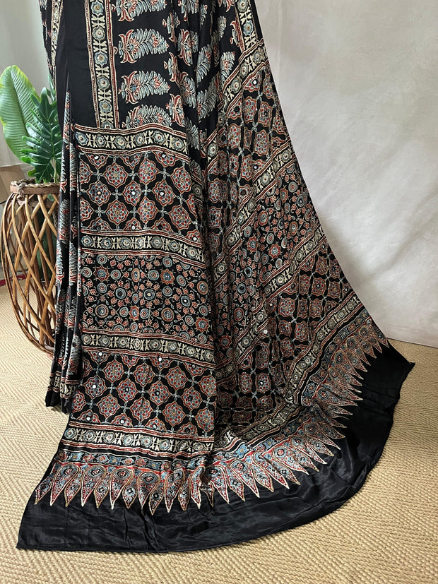 Black modal silk saree with hand work and stitched blouse