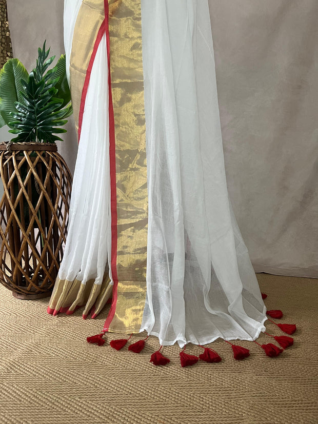 White mulcotton saree with a gold and red border (no Pico and fall)