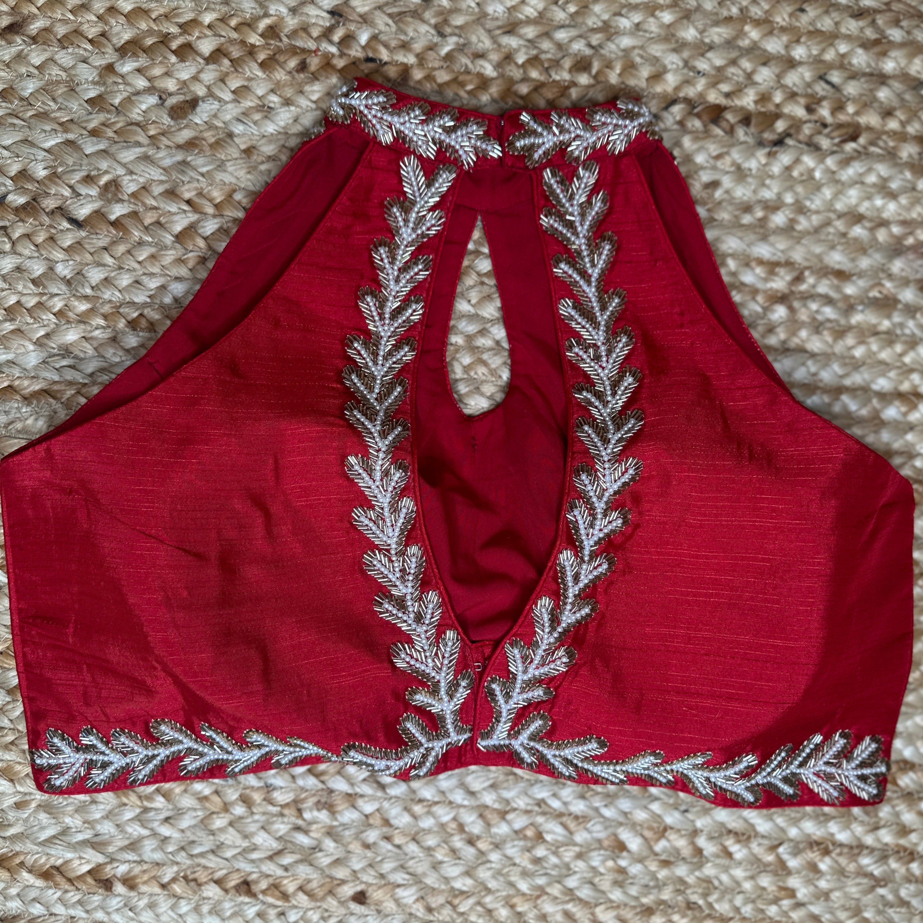 Red halter neck blouse with bead work
