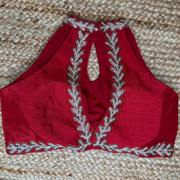 Red halter neck blouse with bead work