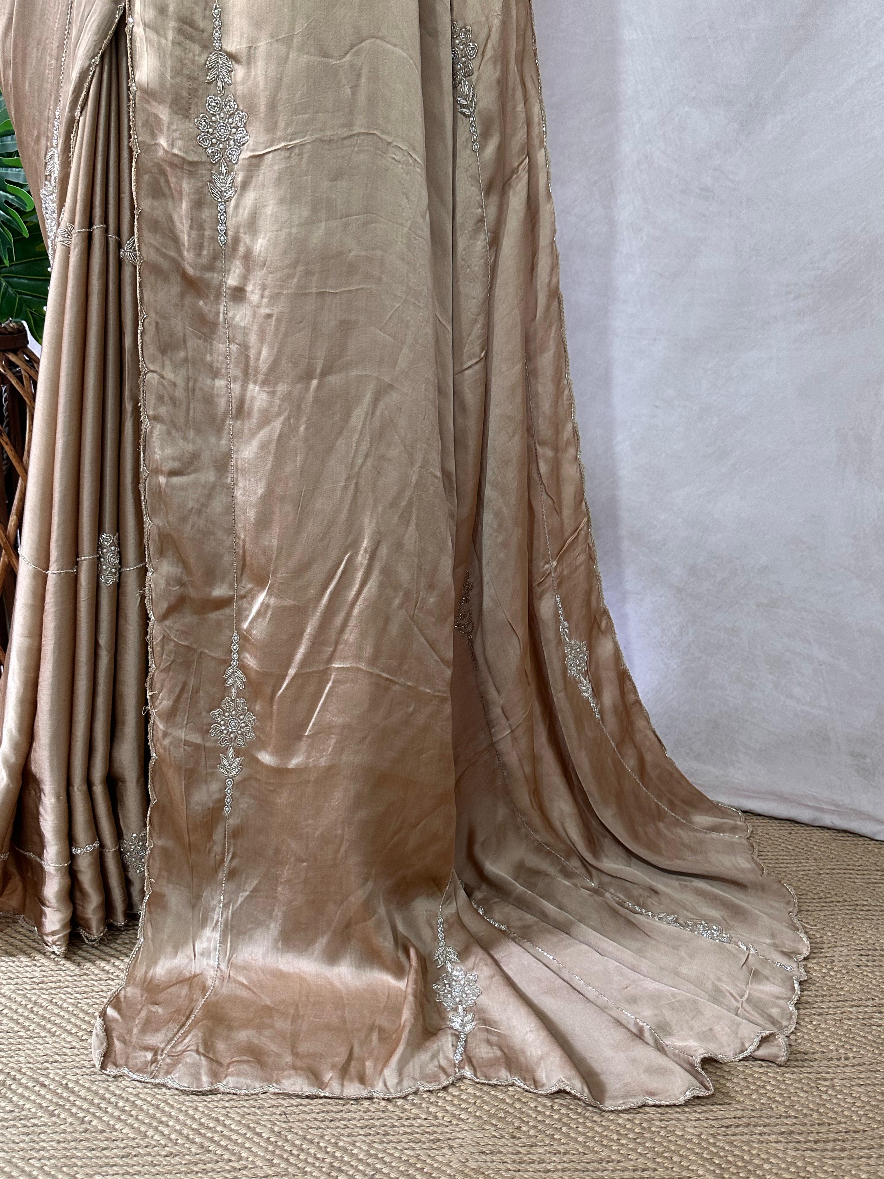 Modal silk saree with hand embroidery and stitched blouse