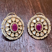 moissanite stud with a magenta stone